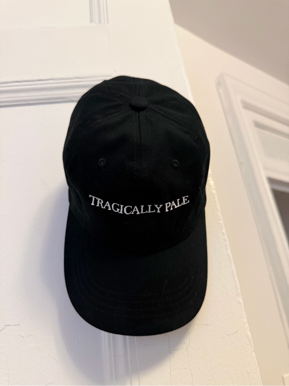 The Classic Black Cap with White Embroidery “Tragically Pale”